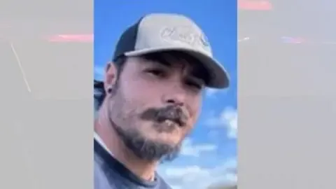 Law enforcement discover body believed to be American father suspected in murdering his children